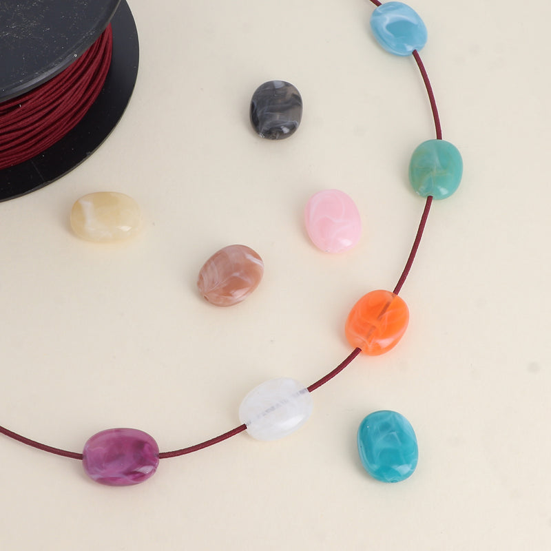 Perles ovales en acétate (lot de 10)