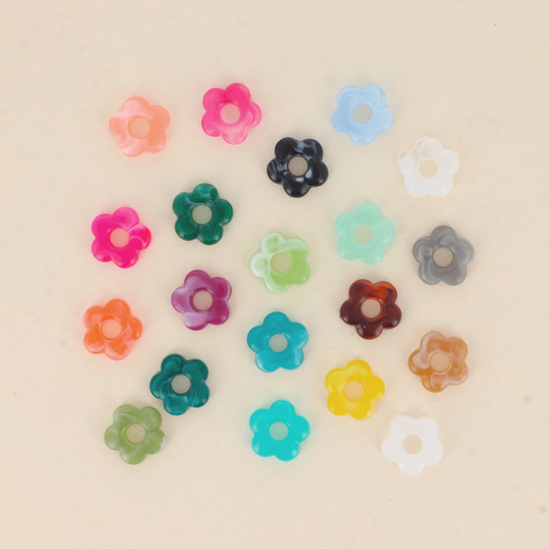 Mini fleur en acétate 15mm (lot de 10)